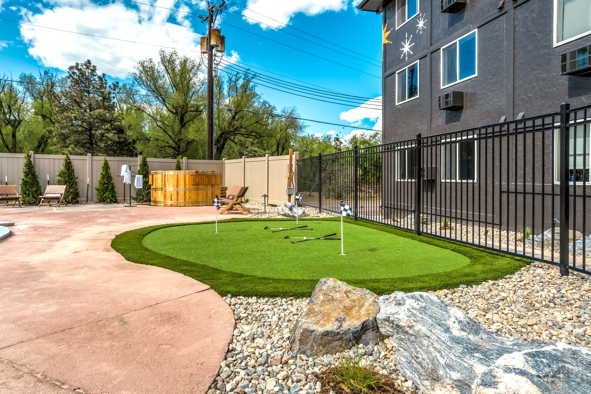 Putting green beside the pool patio at The Outrider Hotel