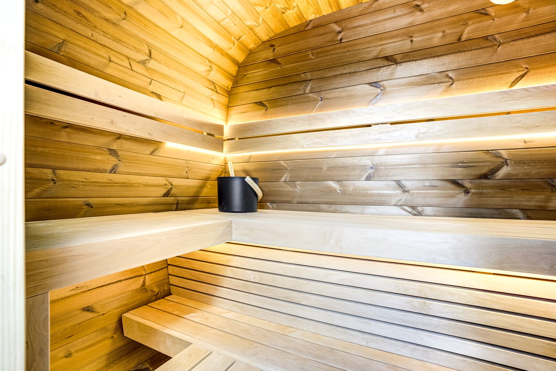 Sauna interior with bucket and ladle at The Outrider Hotel